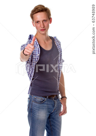 Excited young man showing the thumbs up gesture, Excited young man showing the thumbs up gesture, 63748989