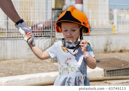 Father teaches his daughter Firefighter training 63749113