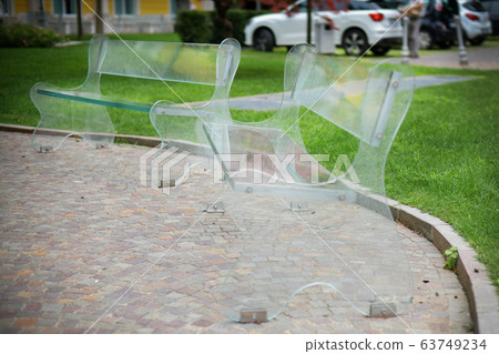 Eco-friendly transparent bench in a leisure park 63749234