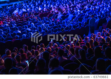 Business conference attendees sit and listen 63749661