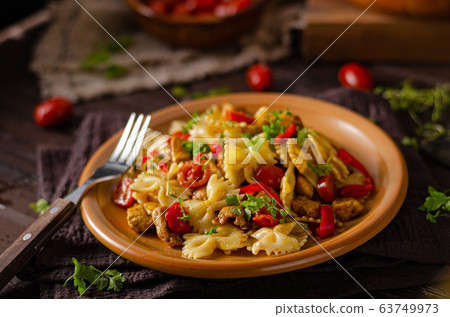 Chicken curry pasta with tomatoes Chicken curry pasta with tomatoes 63749973