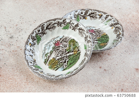 Two antique porcelain bowls on concrete Two antique porcelain bowls on concrete 63750688