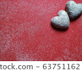 Red dusty background with heart shaped biscuits and text space for valentine's day 63751162