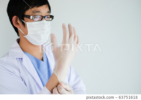 doctor wearing glove to prevent coronavirus and 63751618
