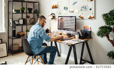 Modern designer working in home office 63753085