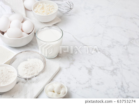 Fresh dairy products on white marble background. 63753274