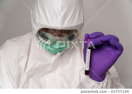 Doctors in the protective suits and masks are 63755194