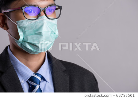 Close up of a businessman in a suit wearing 63755501