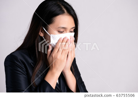 Close up of a businesswoman in a suit wearing 63755506