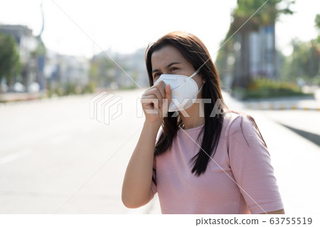Close up of a woman in a suit wearing Protective 63755519