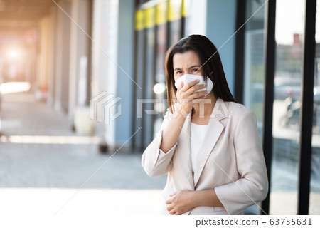 Close up of a businesswoman in a suit wearing Close up of a businesswoman in a suit wearing 63755631
