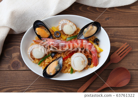 Seafood paella rice dish white background Seafood paella rice dish white background 63761322