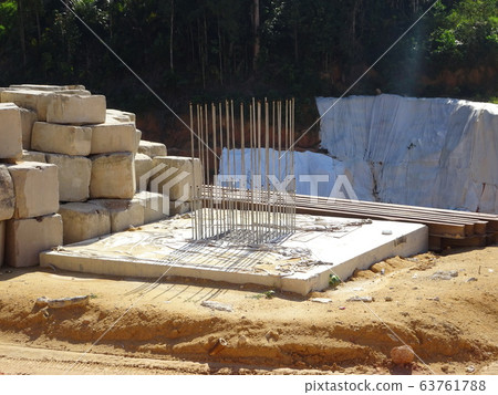 Pile cap and column stump under construction at the construction site. Constructed using reinforced concrete with plywood timber as a form work. 63761788