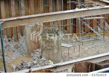 Bore pile cut to level by the construction workers. Next stage is fabricating the pile cap's reinforcement bar and formworks.   63762619