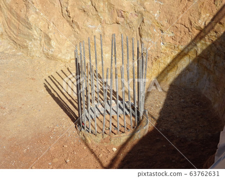 Bore pile cut to level by the construction workers. Next stage is fabricating the pile cap's reinforcement bar and formworks. Bore pile cut to level by the construction workers. Next stage is fabricating the pile cap's reinforcement bar and formworks. 63762631