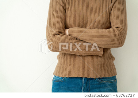 A woman with her arms crossed A woman with her arms crossed 63762727