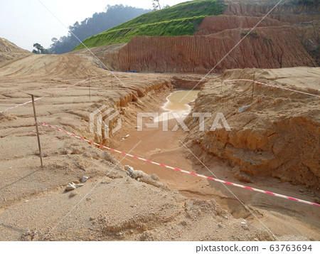 Erosion at ground and slopes is caused by rainfall. The soil structure is weak and there are landslide. Safety measure has been taken in some area. Erosion at ground and slopes is caused by rainfall. The soil structure is weak and there are landslide. Safety measure has been taken in some area. 63763694