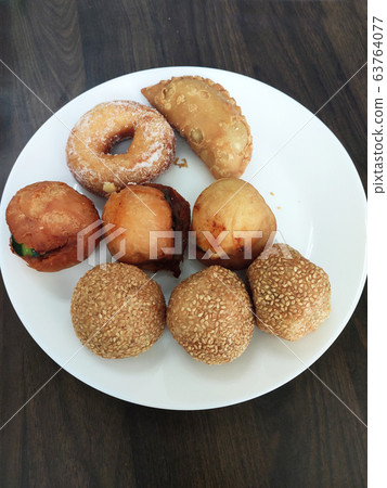 Selective focused on Malaysian traditional cakes are placed in a white plate. 63764077