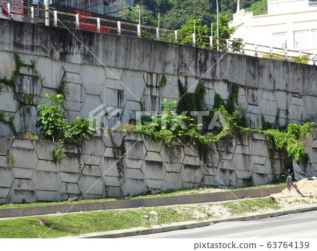 Re-wall mainly called as Reinforced Earth- wall is precast concrete panel constructed with artificial reinforcing and mainly used for retaining walls. Re-wall mainly called as Reinforced Earth- wall is precast concrete panel constructed with artificial reinforcing and mainly used for retaining walls. 63764139