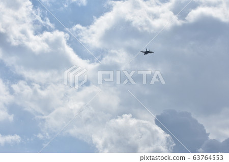 US Navy's FA-18 fighter flying in the sky 63764553