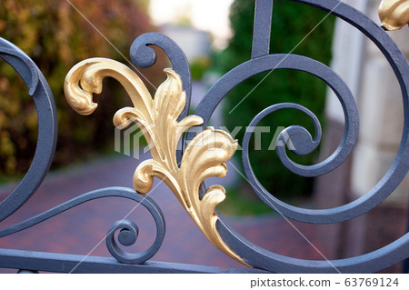 Decorative curved metal gate detail. Decorative curved metal gate detail. 63769124