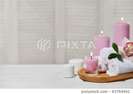 Spa treatments on white wooden table Spa treatments on white wooden table 63769402
