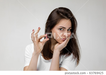 young sad woman suffering from tooth pain young sad woman suffering from tooth pain 63769425