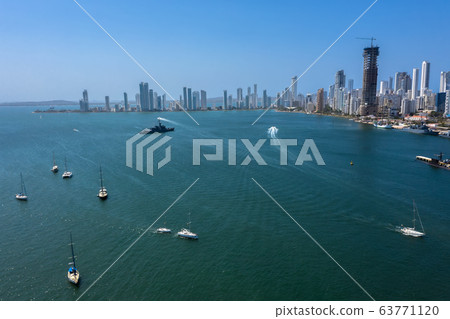 Aerial view of the Beautiful yachts drifting in the bay. A warship patrols the gulf. 63771120