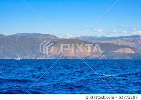Hilly Coast With Wind Farms and Sailing Yacht 63772197