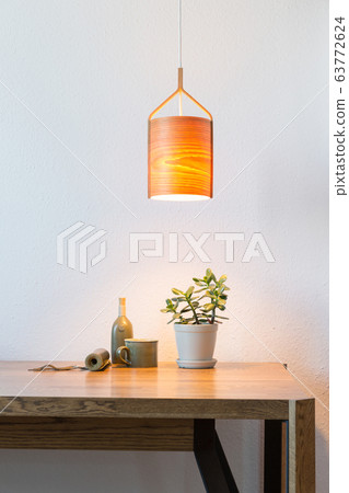turn on wooden lamp over the table turn on wooden lamp over the table 63772624