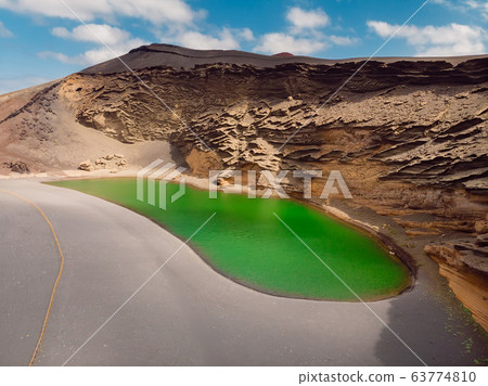 Aerial view of Volcanic crater with a green lake near El Golfo, Lanzarote, Spain. Aerial view of Volcanic crater with a green lake near El Golfo, Lanzarote, Spain. 63774810