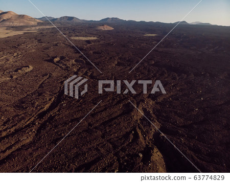 Aerial view of lava fields and volcanos. Lanzarote, Canary Islands. 63774829
