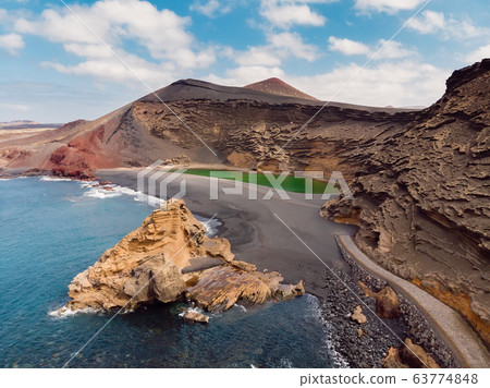 Aerial view of Volcanic crater with a green lake near El Golfo, Lanzarote, Spain. Aerial view of Volcanic crater with a green lake near El Golfo, Lanzarote, Spain. 63774848