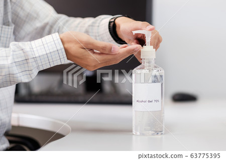 Man hands using wash hand alcohol gel or sanitizer Man hands using wash hand alcohol gel or sanitizer 63775395