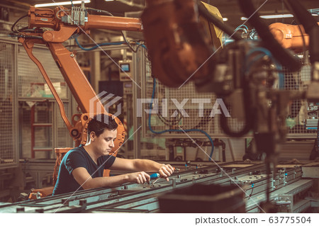 setup and service of the production line with robotic arms in the factory setup and service of the production line with robotic arms in the factory 63775504