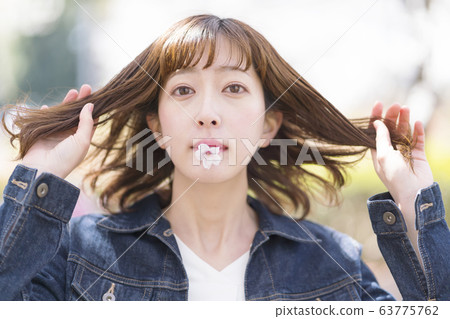 Cherry blossoms and women petals 63775762