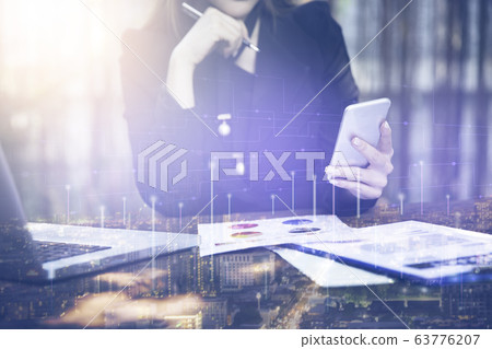 Business woman using smartphone with smart city Business woman using smartphone with smart city 63776207