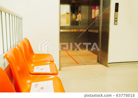 Social distancing red line inside elevator stand position for COVID-19. 63778018