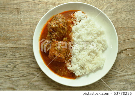 chicken leg spicy and sweet curry or mussaman eat with plain rice on dish 63778256