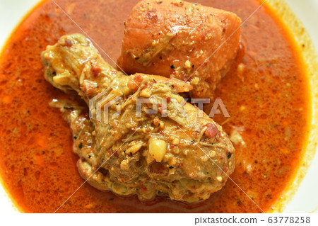 chicken leg spicy and sweet curry or mussaman eat with plain rice on dish 63778258