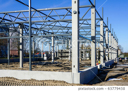 The steel frame of a building under construction The steel frame of a building under construction 63779438