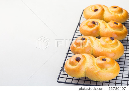 Swedish and scandinavian Christmas saffron buns Swedish and scandinavian Christmas saffron buns 63780407