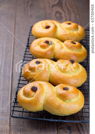 Swedish and scandinavian Christmas saffron buns Swedish and scandinavian Christmas saffron buns 63780408