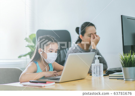 mom working at home with her child on the table mom working at home with her child on the table 63781676