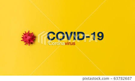Inscription COVID-19 or Coronavirus on yellow background Inscription COVID-19 or Coronavirus on yellow background 63782687