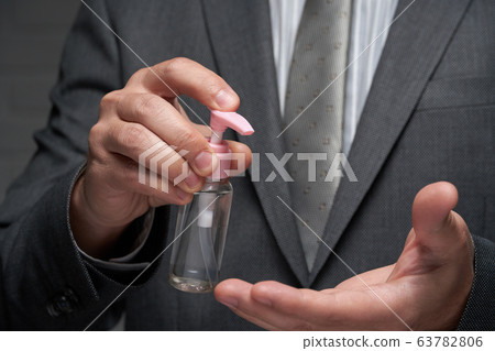 a man demonstrates a protective face mask for a man demonstrates a protective face mask for 63782806