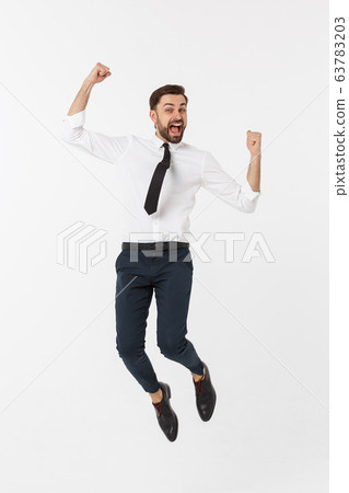 Young happy caucasian businessman jumping in the air , isolated on white background. Young happy caucasian businessman jumping in the air , isolated on white background. 63783203