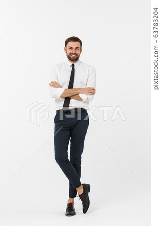 Portrait of a confident young businessman with hands in pockets on white background Portrait of a confident young businessman with hands in pockets on white background 63783204