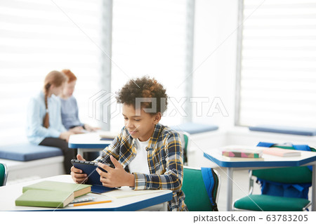 African-American Boy Playing Games in Class African-American Boy Playing Games in Class 63783205