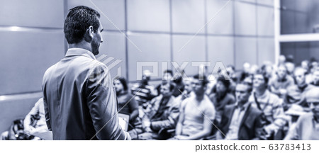 Public speaker giving talk at business event. Public speaker giving talk at business event. 63783413